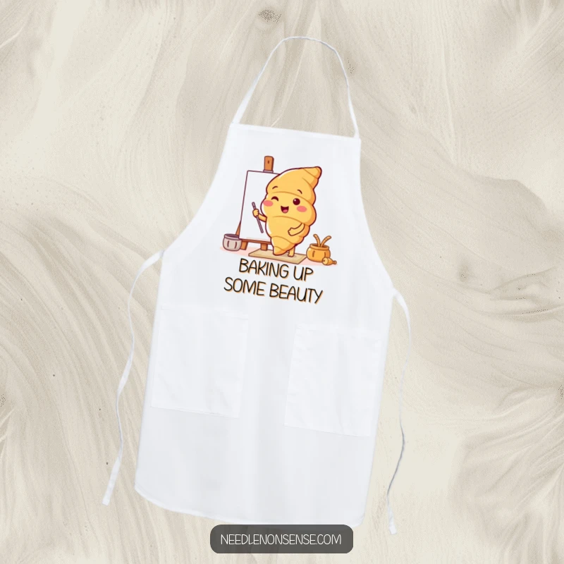 Funny apron featuring a cheerful croissant character preparing a canvas, perfect for protecting clothes during artistic endeavors.