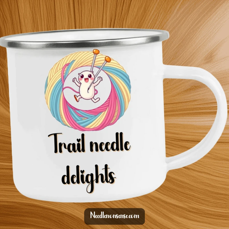 Funny enamel camping mug showing a needle character gleefully leaping through a colorful thread loop, ready for outdoor crafting.