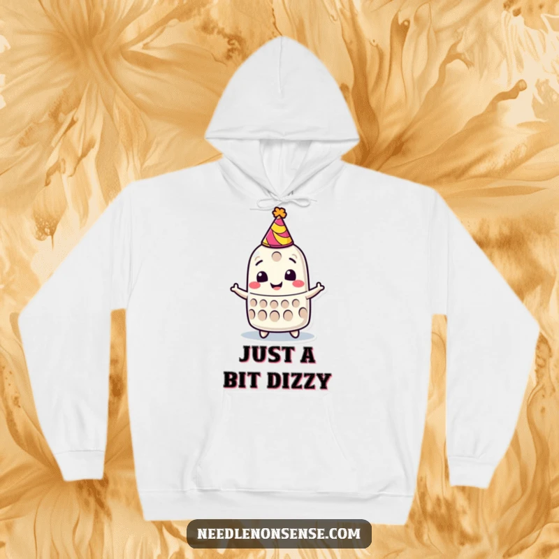 Funny hoodie showing a smiling thimble character wearing a tiny party hat, spinning happily in celebration.