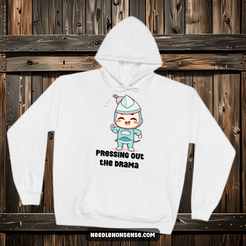 Funny hoodie with a determined iron character joyfully smoothing out wrinkles, perfect for cozy focus.