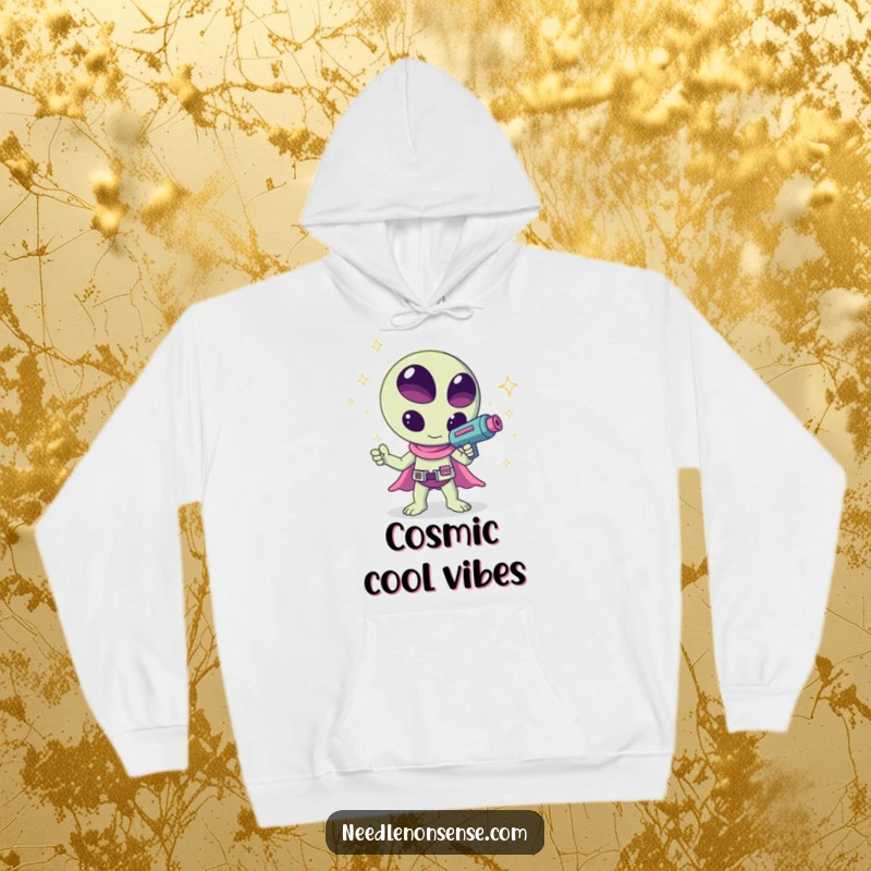 Funny kawaii alien waving a ray gun that shoots sparkles, a humorous and cozy design on this hoodie, ideal for chilling.