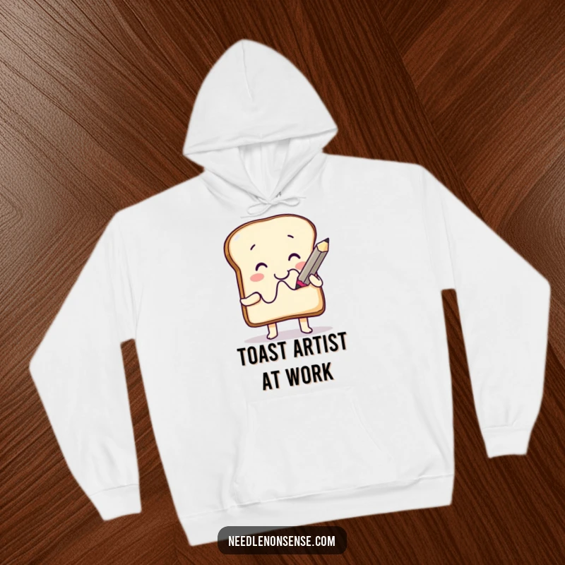 Funny Hoodie: A cheerful toast character artistically drawing a funny squiggle with an oversized pencil, perfect for cozy humor.