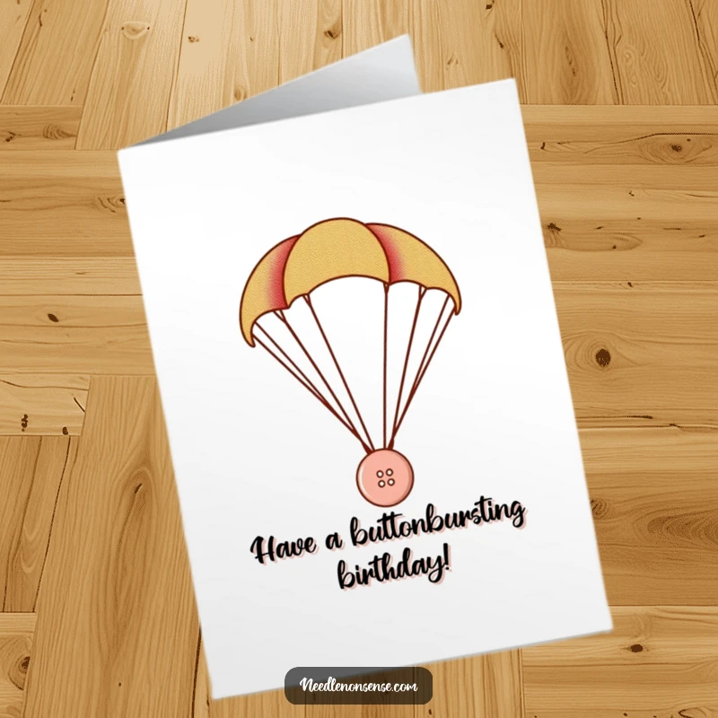 Funny Free Printable Birthday Card: Tiny button parachuting on fabric, a whimsical and fun birthday greeting.