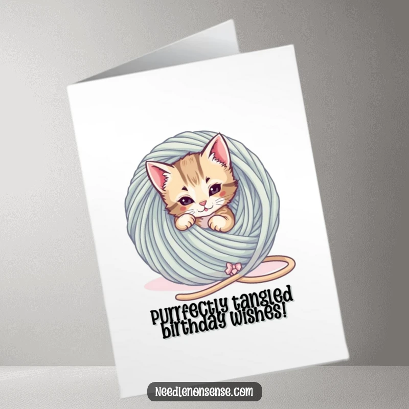 Funny Free Printable Birthday Card: Playful kitten hilariously tangled in a giant ball of yarn, a birthday surprise.