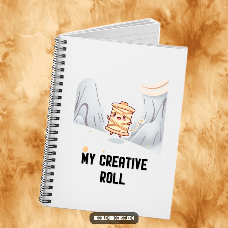 Funny notebook with a happy spool of thread character zipping across a fabric landscape, ideal for jotting ideas.