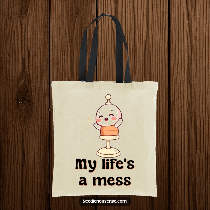 Funny tote bag featuring a giggling bobbin character spinning enthusiastically, ideal for carrying sewing supplies with a laugh.