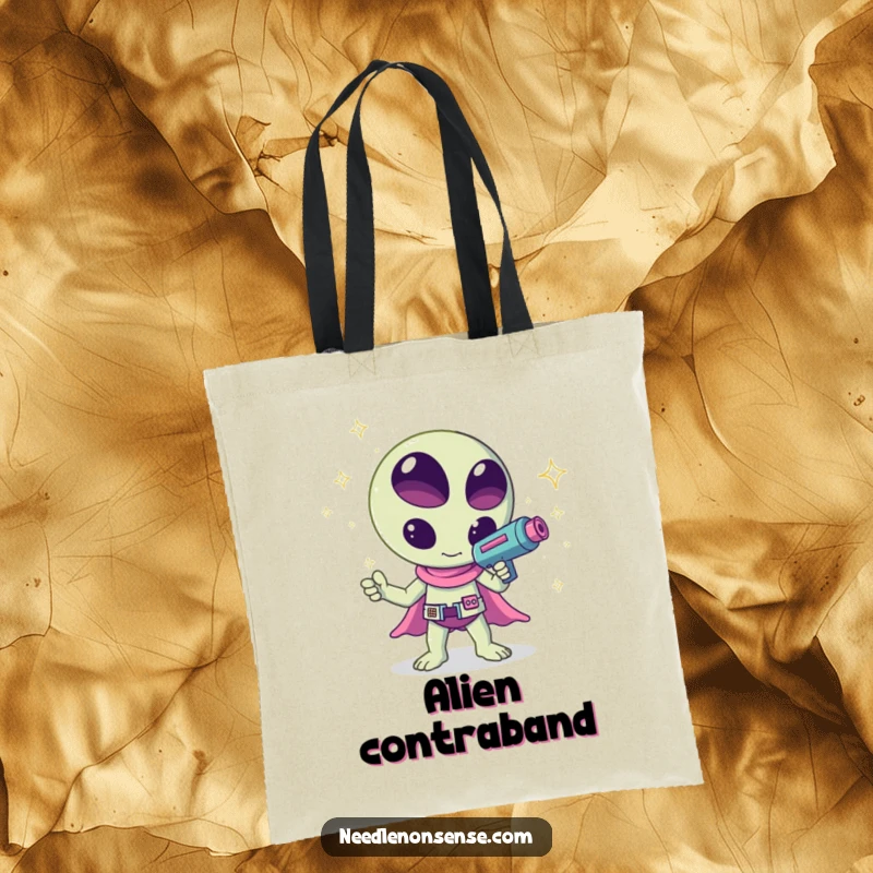 Funny kawaii alien waving a ray gun shooting sparkles, a humorous and creative design on this tote bag, great for shopping.