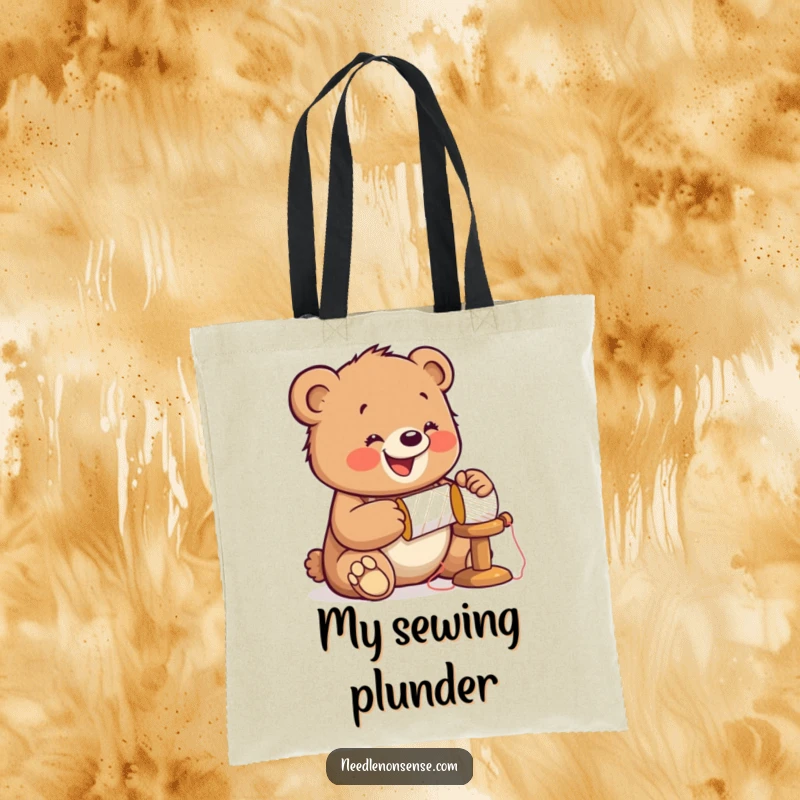 Funny Bear Sewing Tote Bag, showing a bear cub enthusiastically hammering a spool, perfect for carrying sewing supplies.